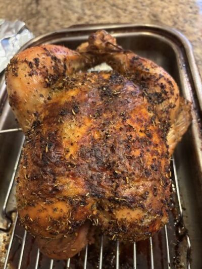 This is a picture of the roast chicken with crispy skin after coming out of oven.